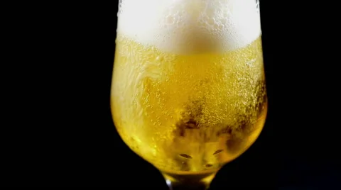 Pouring Refreshing Cold Beer in a Glass, Fizzy Bubbles Stock Footage 63335757