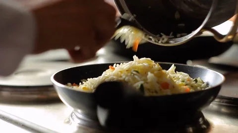 Pouring Rice basmati with vegetables in a pan, HD footage 動画素材 72965283