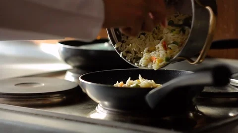 Pouring Rice basmati with vegetables in a pan, HD footage 動画素材 72965286