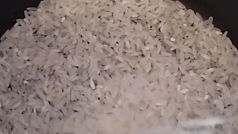 Pouring rice Stock Footage 212499159