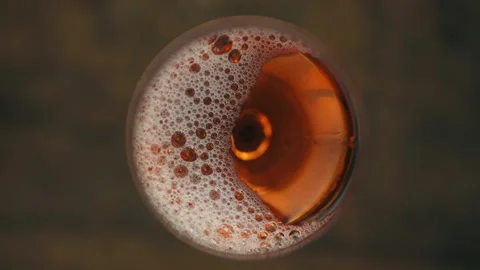 Pouring rose wine into a glass Stock Footage