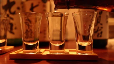 Pouring Sake into Glasses Sequence Stock Footage 285201955