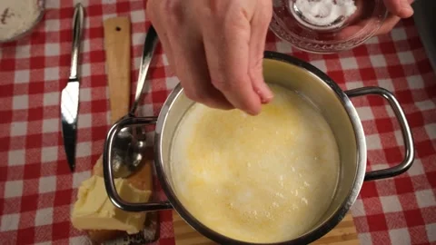 Pouring salt into pot Stock Footage 237746360