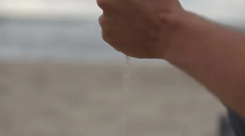 Pouring sand through fingers Stock Footage 61934693
