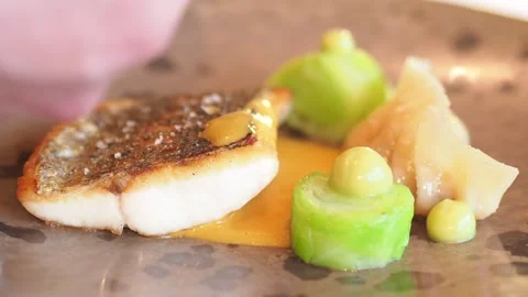 Pouring Sauce on a piece of cod fillet, Fine Dining in Netherlands. Stock Footage 274440981