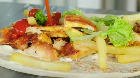 Pouring sauce on shawarma Stock Footage 145789553