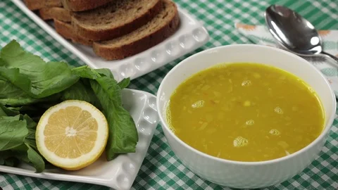 Pouring sauce into soup Stock Footage 104239922