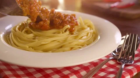 Pouring sauce onto spaghetti Stock Footage 57321361