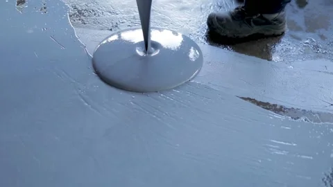 Pouring Self-Leveling Floors. Self-Leveling Floors On A Large Area, A Worker Stock Footage 150866839