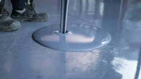 Pouring Self-Leveling Floors. Self-Leveling Floors On A Large Area, A Worker Stock Footage 150866885
