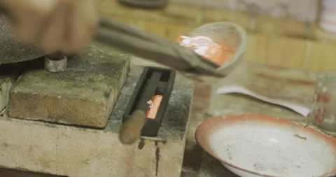 Pouring Silver into cast Stock Footage 141368222