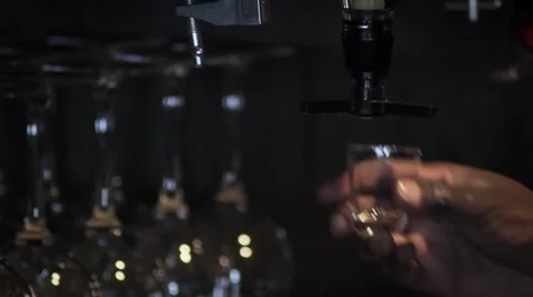 Pouring small alcohol glas Stockbeeldmateriaal 47545512