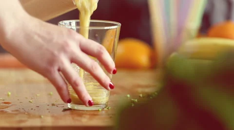 Pouring smoothie into glass Stock Footage 59540887