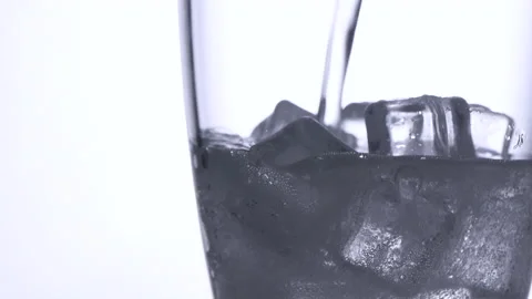 Pouring soda on ice cube isolated on white background, Stock Footage 161173123