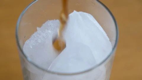 Pouring Soda with ice cubes close-up Stock Footage 126048095