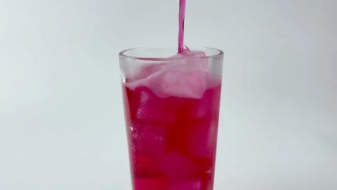 Pouring soft Drinks, red soda into Glass Isolated o White Background Stock Footage 161406981