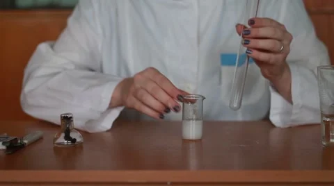 Pouring the solution into a test tube Stock Footage 48677750