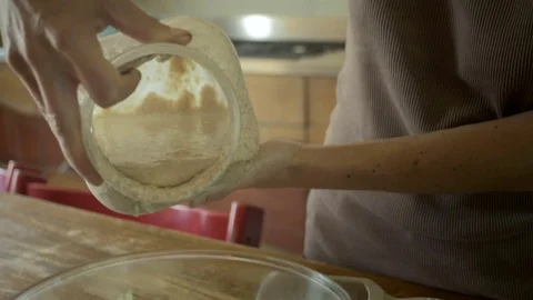Pouring sourdough Stock Footage 76792611