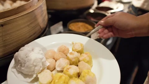 Pouring Soy Sauce Over Steamed Dim Sum and Shumai Dumplings Stock Footage 333603465