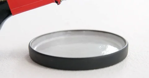 Pouring soy sauce into plate on white background Stock Footage
