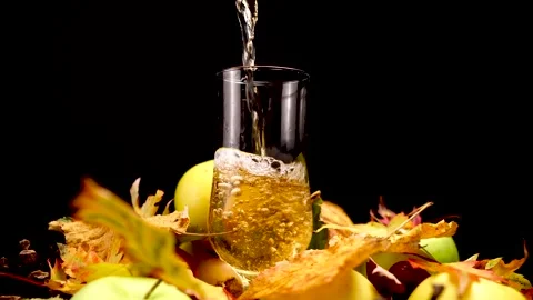 Pouring Sparkling Apple Cider Alcoholic Drink From a Bottle to Glass, Close Up Stock Footage 145698527