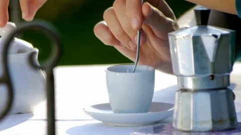 Pouring Steaming Coffee Into a white Mug From Black Italian Moka Coffee Stock Footage 88655179