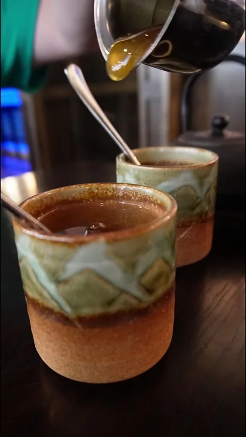 Pouring a steaming hot beverage Stock Footage 262570473