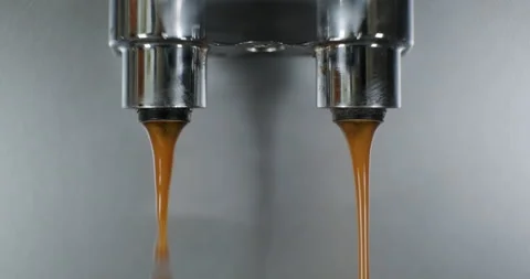 Pouring stream from automatic coffee machine making espresso 動画素材 235821440