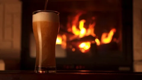 Pouring stream into glass bocal of refreshment beer with foam and air bubbles 動画素材 103549059