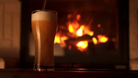 Pouring stream into glass bocal of refreshment beer with foam and air bubbles 動画素材 103549351