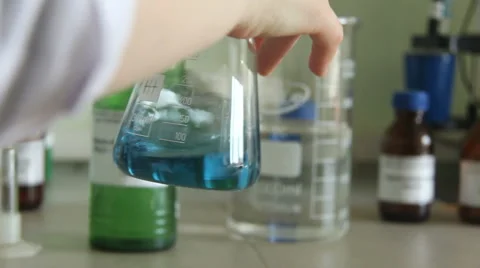 Pouring the substance from the beaker Stock Footage 66341452