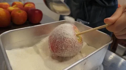 Pouring Sugar Coating on Candied Apple Close Up Stock Footage Video stock 345292753