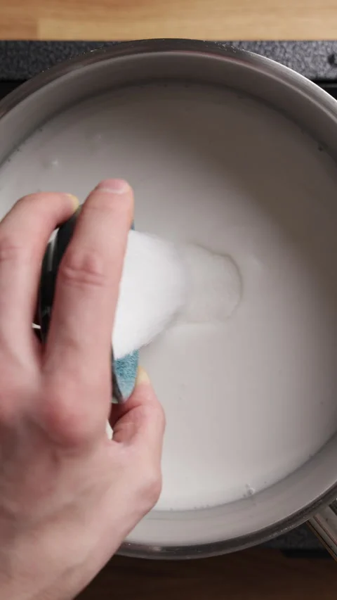Pouring Sugar Into Coconut Milk Vertical Top View Close Up Видео 335037416