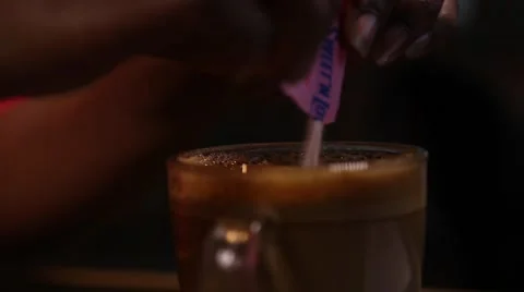 Pouring sugar into coffee Stock Footage