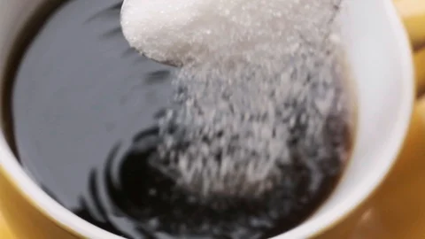 Pouring sugar into coffee Stock Footage 115771886