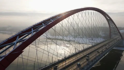 Pouring sunlight over the bases of the bridge. Span near the Novosibirsk Bridge Stock Footage 145304613