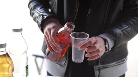 Pouring syrup into a cup Stock Footage 79075449