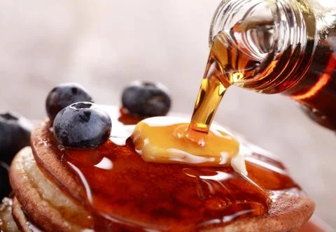 Pouring syrup Stock Photos