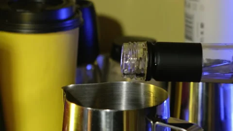 Pouring syrup into a pitcher. Slow motion. Stock Footage 183969425