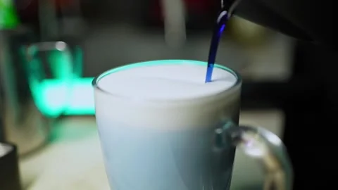 Pouring syrup when making a coffee cocktail Stock Footage 303835116