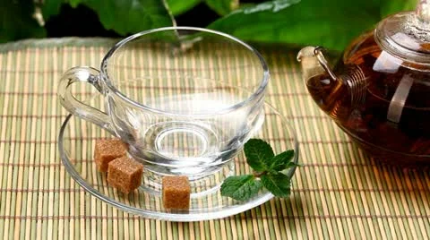 Pouring tea into cup Stock Footage 20644841