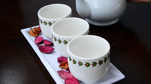 Pouring tea into cup Stock Footage 32325712