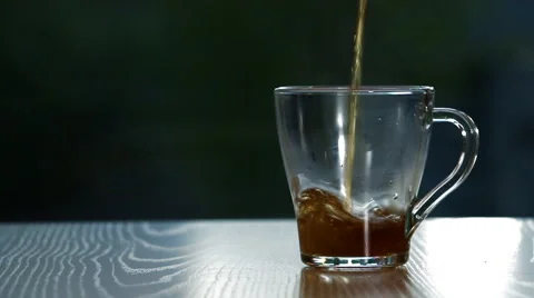 Pouring Tea in a cup. Video stock 50055145