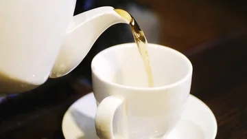 Pouring tea into a cup Stock Footage 86099573