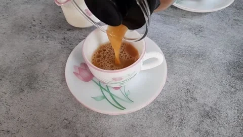 Pouring tea in a cup Stock Footage 154198491