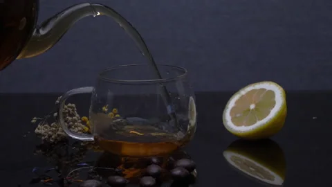 Pouring tea into a cup Stock Footage 178434952