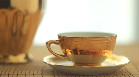 Pouring tea into the cup from kettle Video stock 47694982