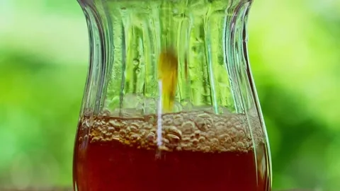 Pouring Tea Into A Glass Video stock 135138274