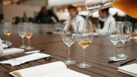 Pouring tea into glass at professional tea tasting event Stock Footage 345848203