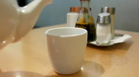 Pouring tea inside Chinese restaurant with 4k resolution. Stock Footage 61219704